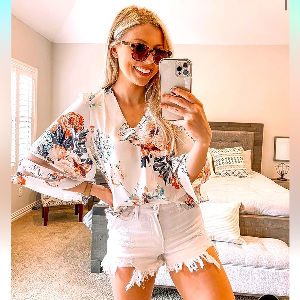 Flattering, V-neck, bell-sleeve blouse with mesh details in sleeve